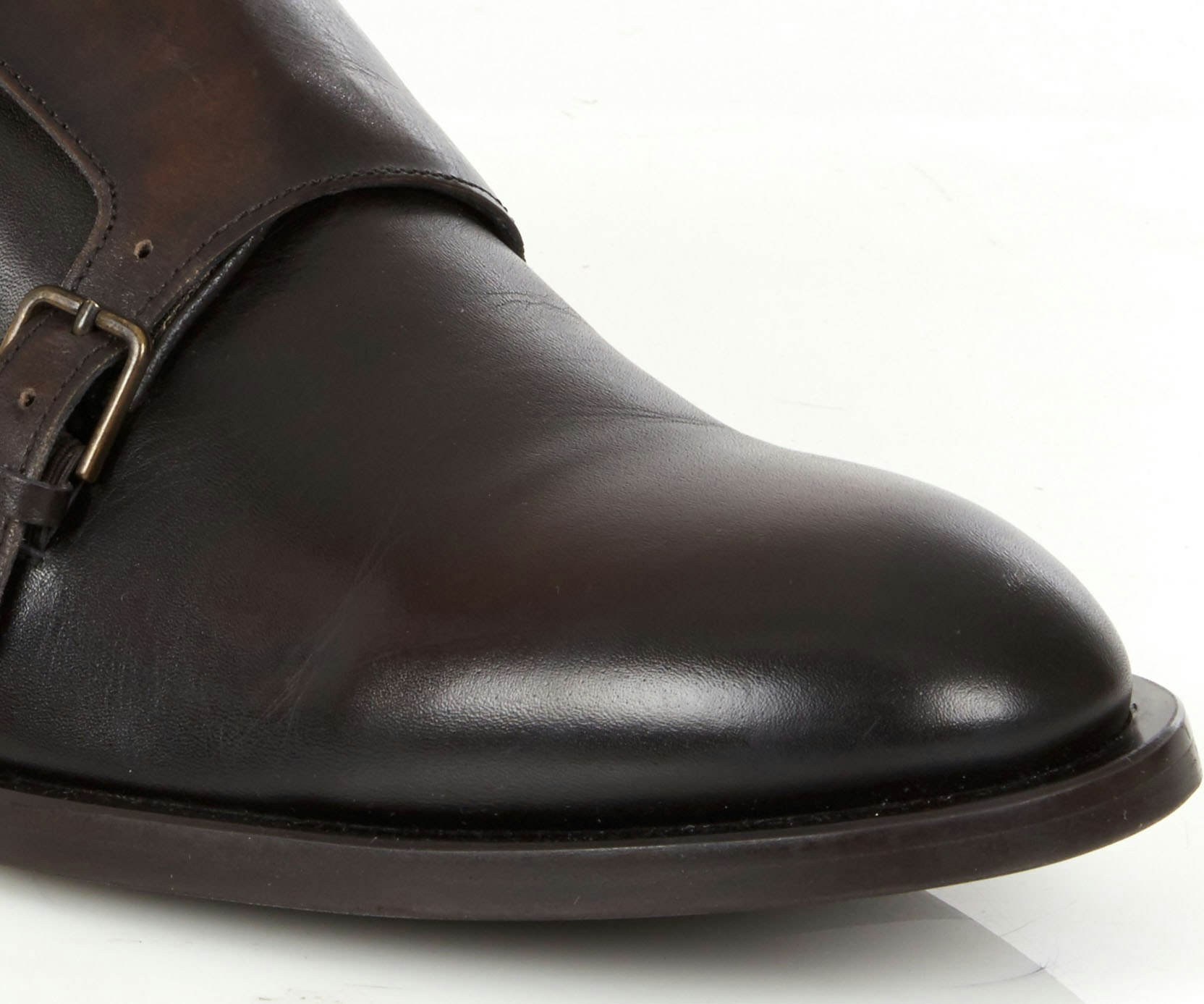 footwear-retouching-leather-marks-before Closeup product photo of leather shoe showing signs of wear